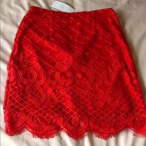 Lace red skirt.